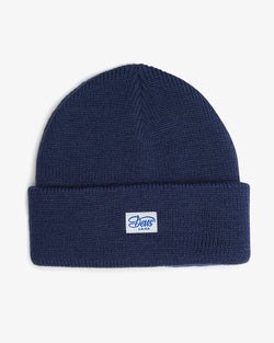 blue deep fit classic skull cap beanie with front branded label in 100% acrylic yarn plain knit